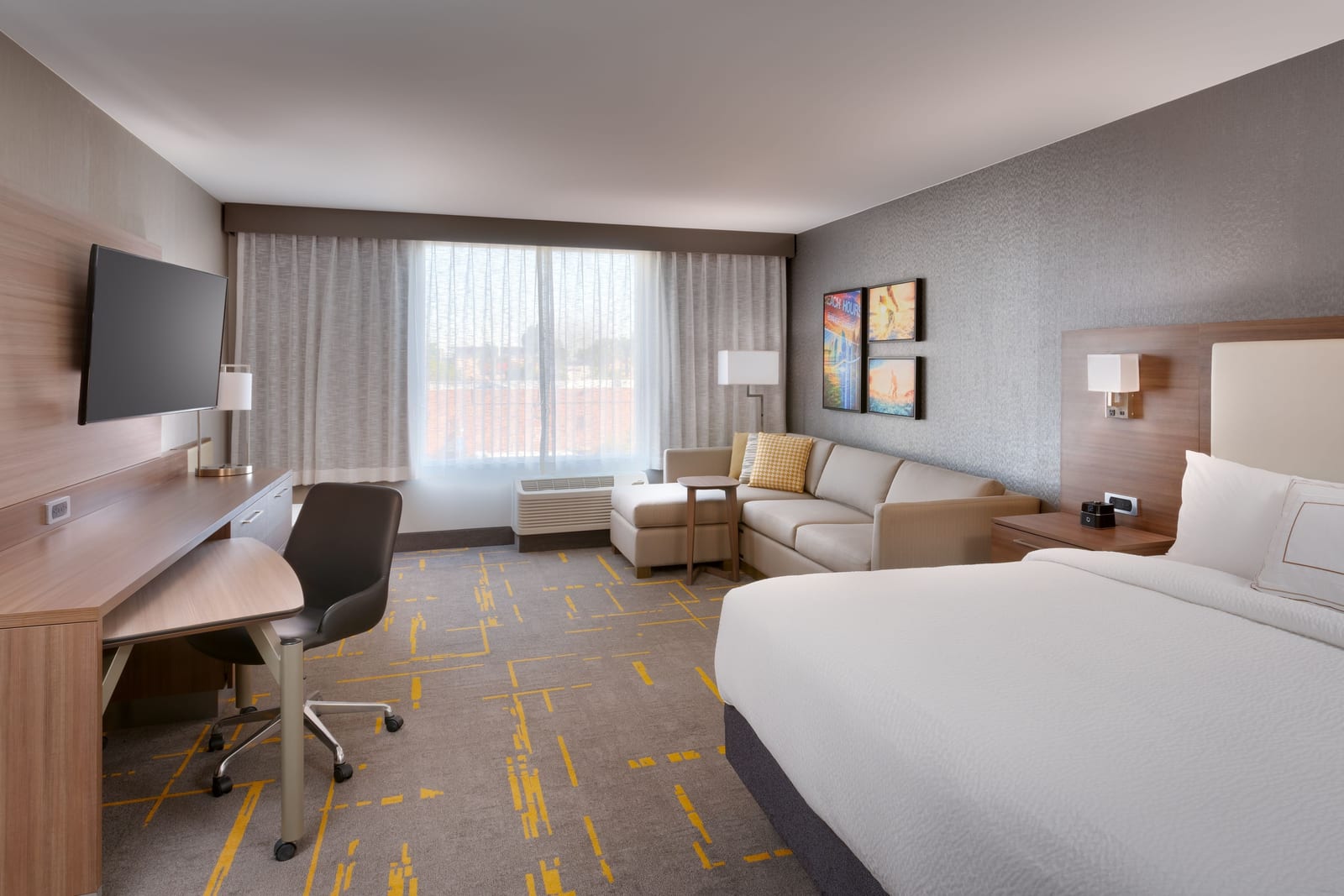 King suite with a sofa sectional, desk and full kitchen at TownePlace Suites by Marriott Los Angeles LAX/Hawthorne